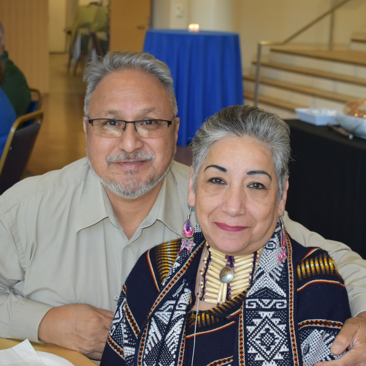 Alumni couple embracing each other at an alumni reunion event.